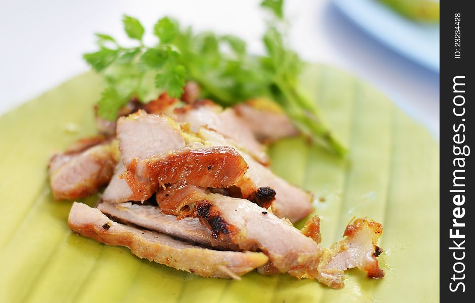 A delicious sliced grilled pork served  with vegetables. A delicious sliced grilled pork served  with vegetables