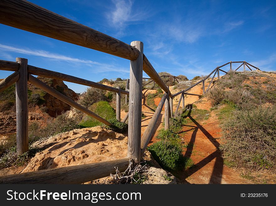 Wooden railings on the cliff at the coast in Portugal