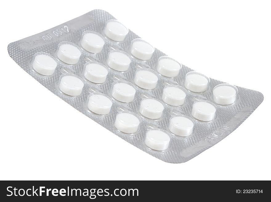 White pills isolated on a white