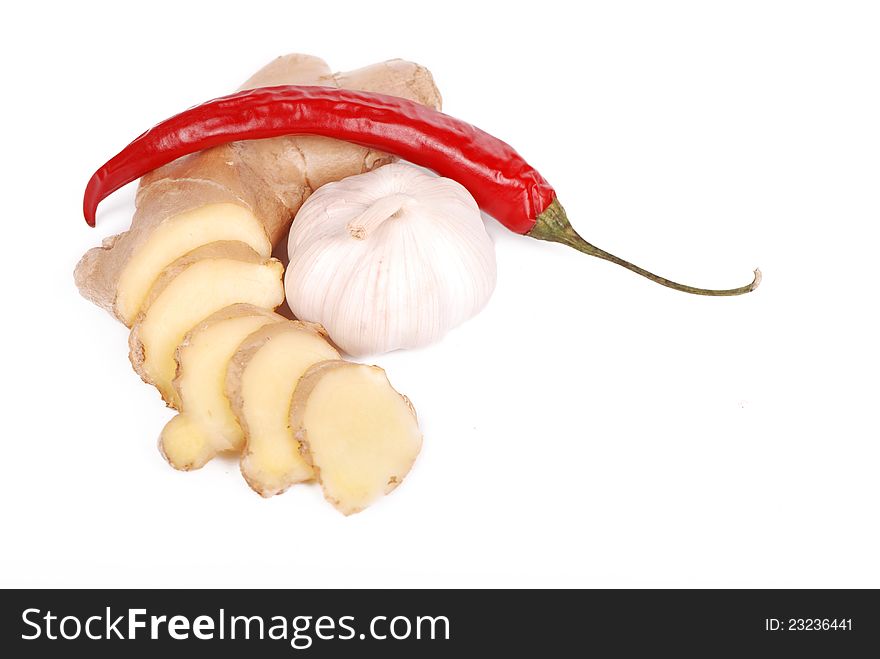 Garlic, hot red pepper and ginger over white background. Garlic, hot red pepper and ginger over white background