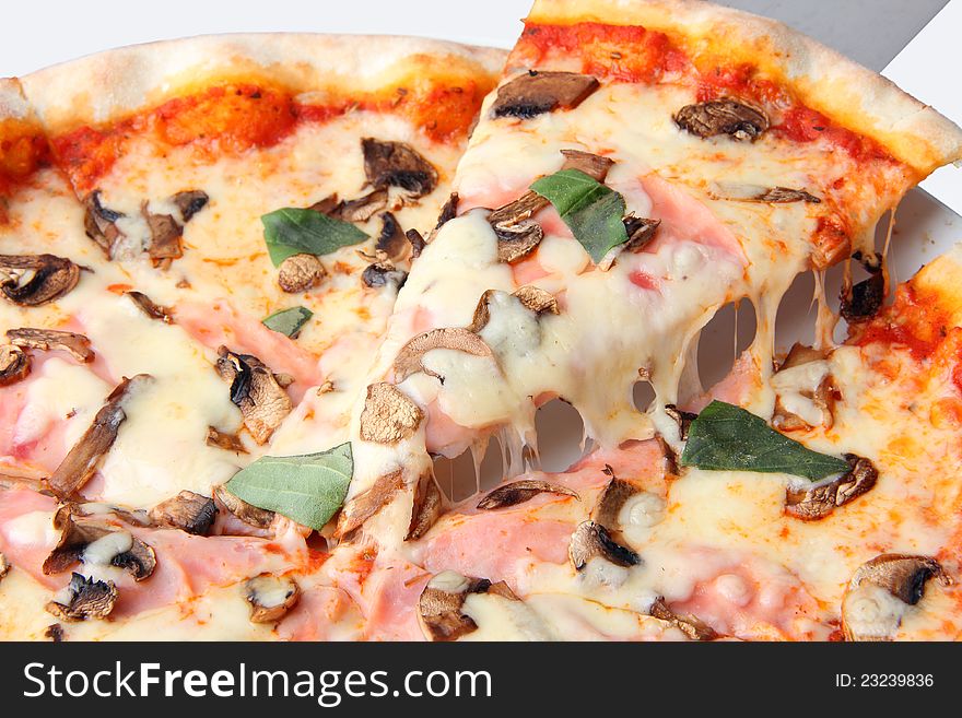 Close up of pizza with champignons and ham over white background. Close up of pizza with champignons and ham over white background.