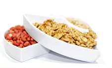 White Plats With Walnuts, Peanut And Pine Nut Stock Photos