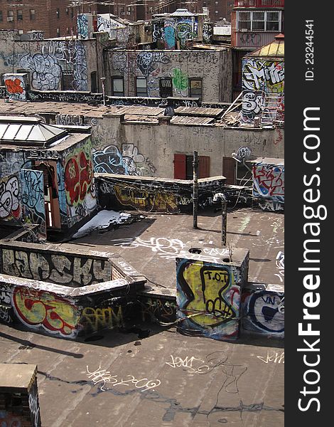 Damaged rooftops with graffiti artwork in New York, USA. Damaged rooftops with graffiti artwork in New York, USA.