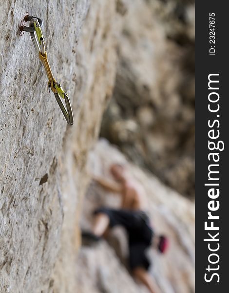 Climbing cam and climber in background