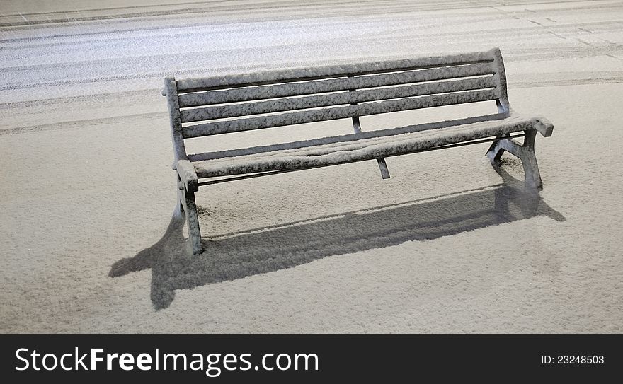Bench under snowfall