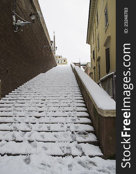 Ancient steps under snow in Rome Center