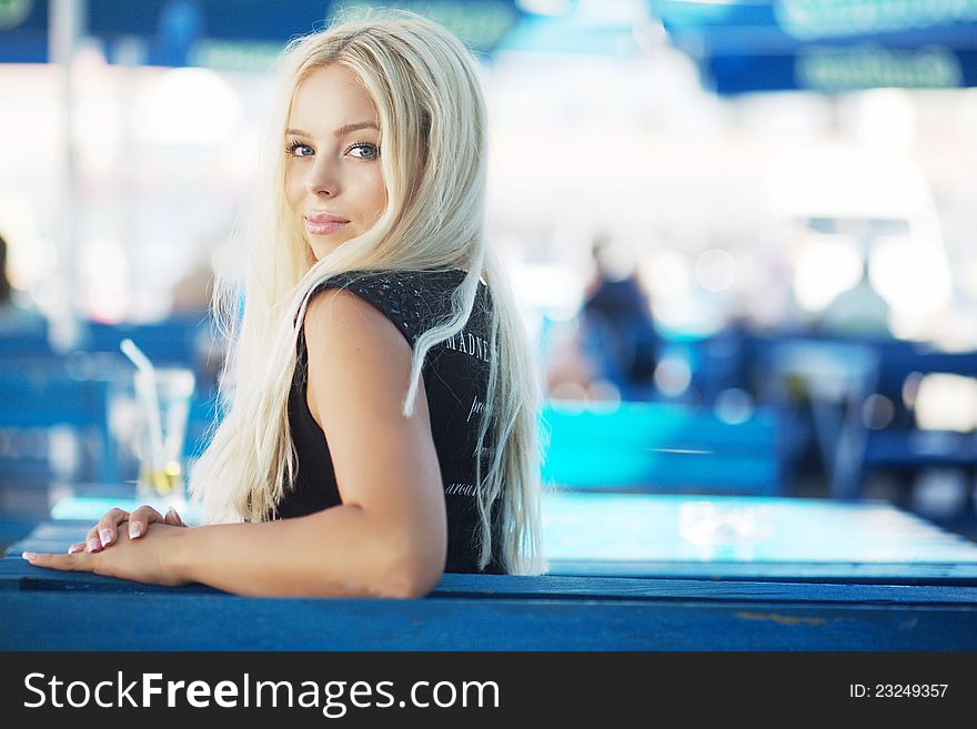 Portrait of a beautiful young blond woman in a cafe. Portrait of a beautiful young blond woman in a cafe