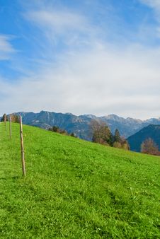 Meadow With Light Fence And Blue Sky Background Royalty Free Stock Photography Meadow With Light Fence And Blue Sky Background Royalty Free Stock Photography