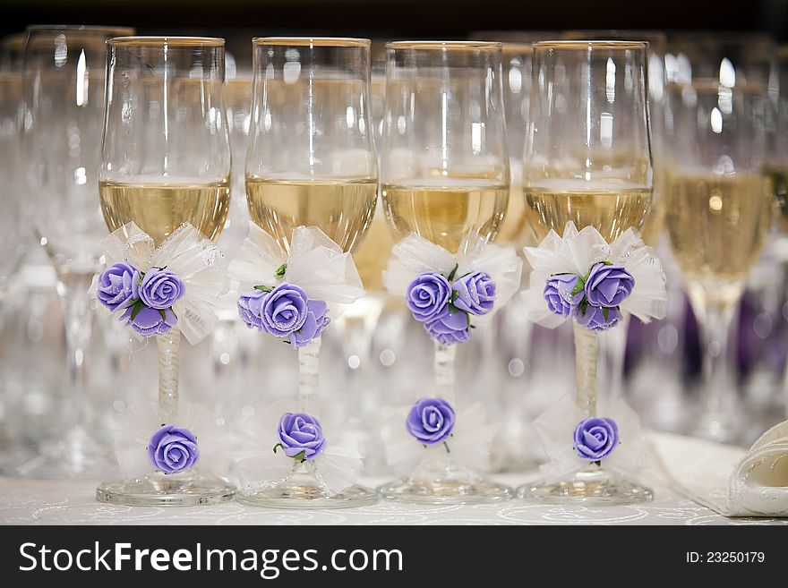 champagne glasses with decorative flowers. wedding decorative glasses. champagne glasses with decorative flowers. wedding decorative glasses