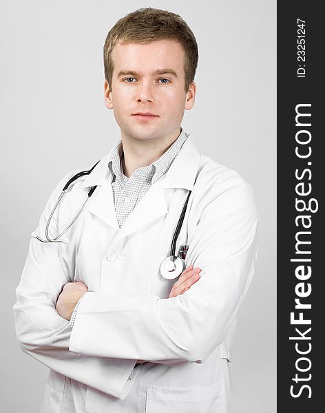 Young doctor isolated on gray background. Young doctor isolated on gray background
