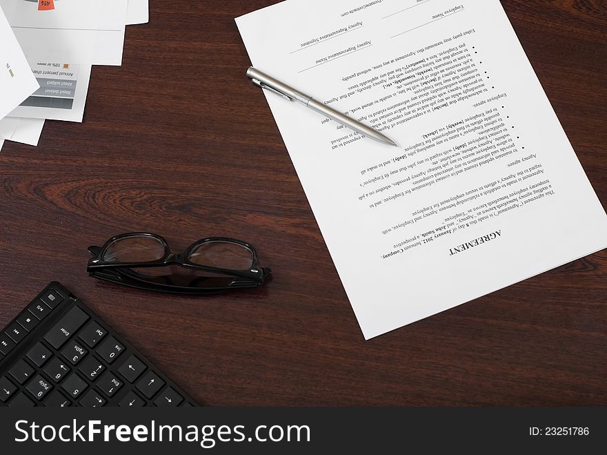 Signing agreement on the table. Signing agreement on the table