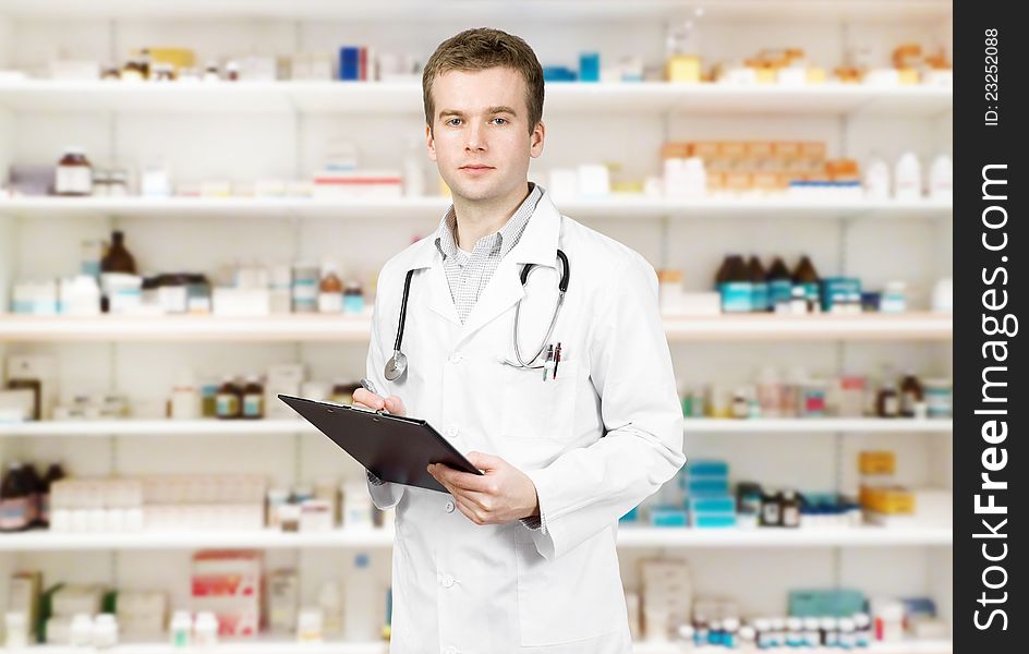 Portrait of a male pharmacist at pharmacy. Portrait of a male pharmacist at pharmacy