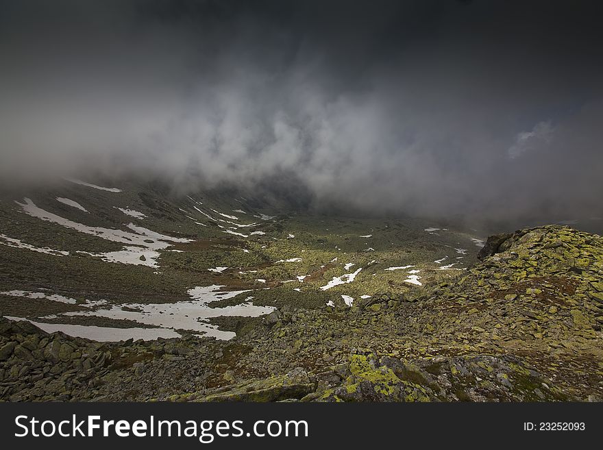 Beautiful cloud scenery in the Alps in summer in dramatic light. Beautiful cloud scenery in the Alps in summer in dramatic light