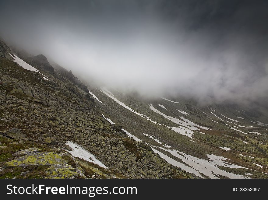 Beautiful cloud scenery in the Alps in summer in dramatic light. Beautiful cloud scenery in the Alps in summer in dramatic light