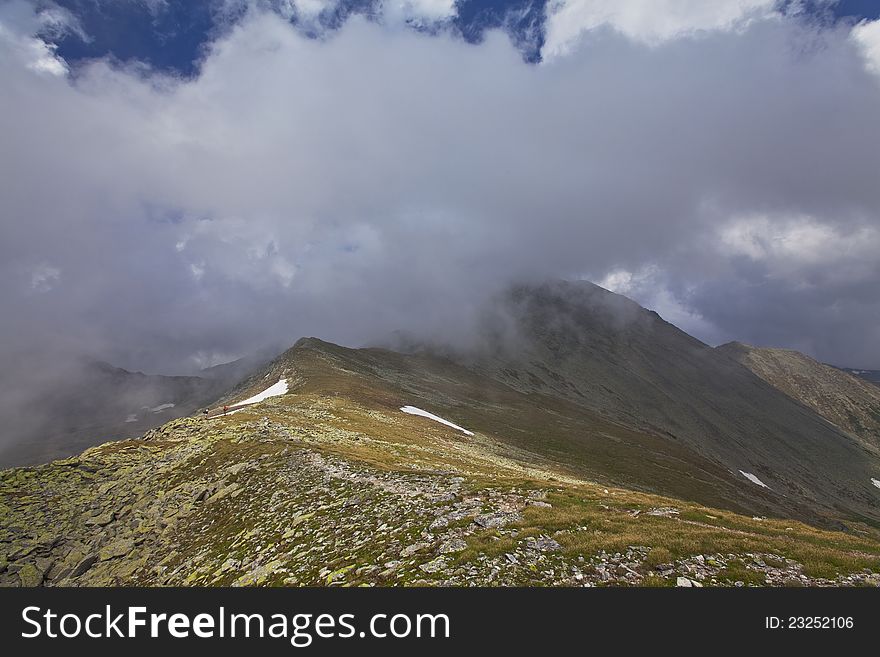 Beautiful cloud scenery in the Alps in summer in dramatic light. Beautiful cloud scenery in the Alps in summer in dramatic light