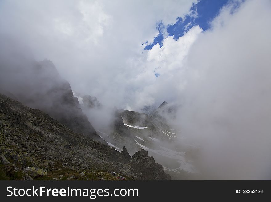 Beautiful cloud scenery in the Alps in summer in dramatic light. Beautiful cloud scenery in the Alps in summer in dramatic light
