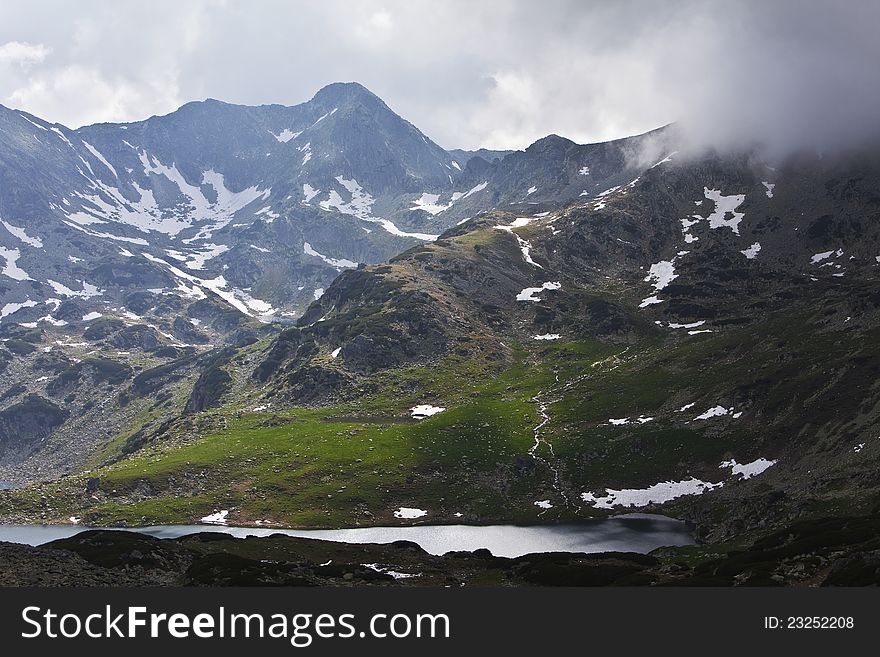 Beautiful cloud scenery in the Alps in summer in dramatic light. Beautiful cloud scenery in the Alps in summer in dramatic light