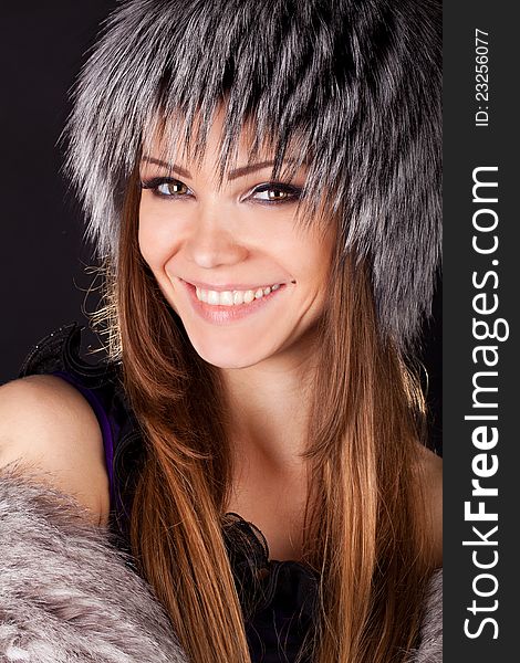 Portrait Of A Beautiful Smiling Woman In Furs