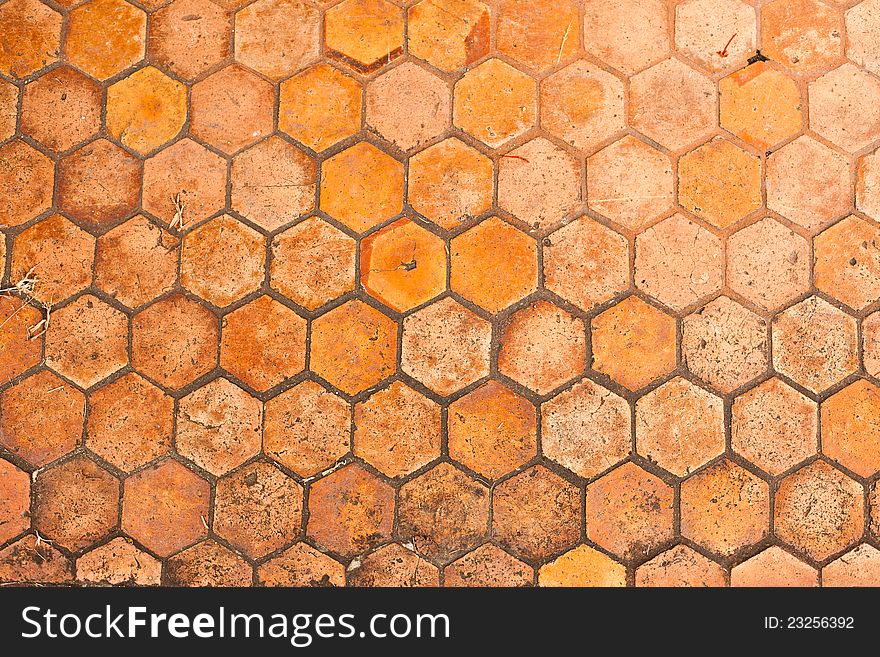Pathway made by brown and orange hexagon bricks. Pathway made by brown and orange hexagon bricks