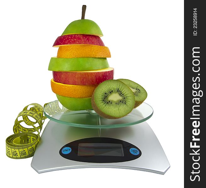 The mixed fruit on scales and a measurement tape. The mixed fruit on scales and a measurement tape