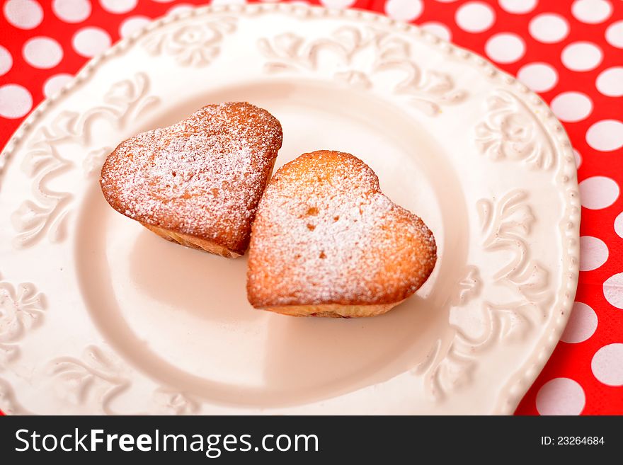 Heart shaped muffins in vintage plate ready to serve.