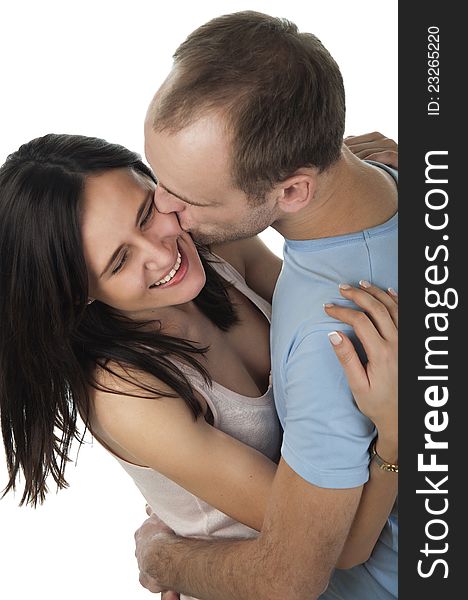 A view of loving couple kissing on white background