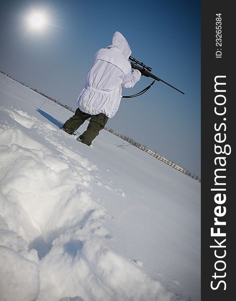 Man preparing to take a long shot during a winter blizzard. Man preparing to take a long shot during a winter blizzard