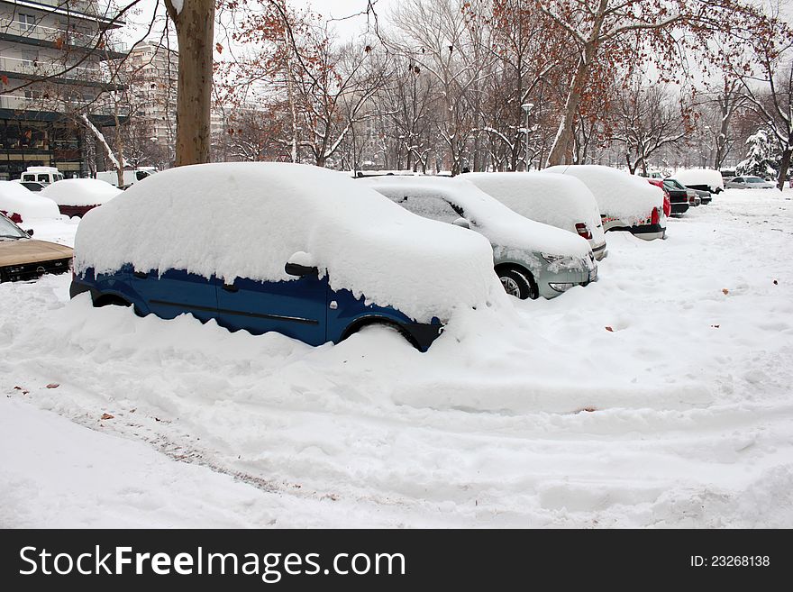 Photo of a cars almost totally covered in snow. Photo of a cars almost totally covered in snow