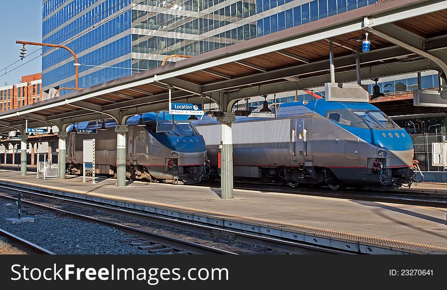 Passenger trains at an old railway station in the city. Passenger trains at an old railway station in the city.