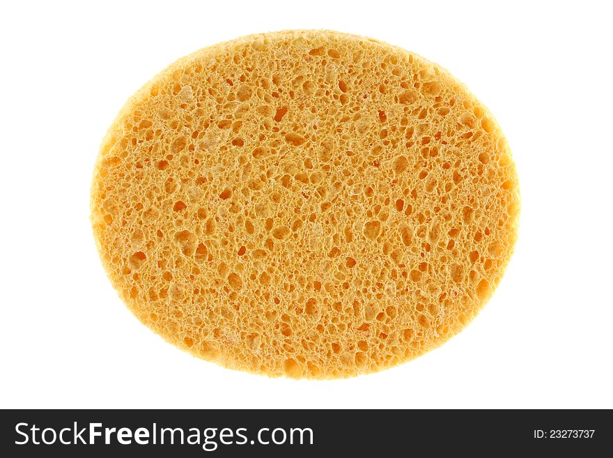 A round yellow natural facial cellulose sponge isolated on white