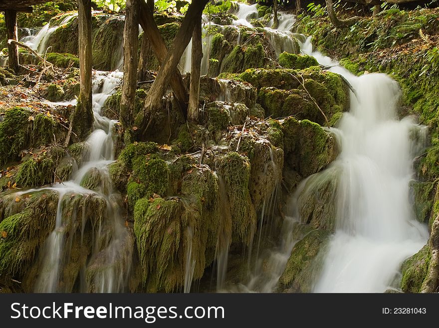 Waterfall in the forest at Plitvicka Jezera - Plitvice. Waterfall in the forest at Plitvicka Jezera - Plitvice