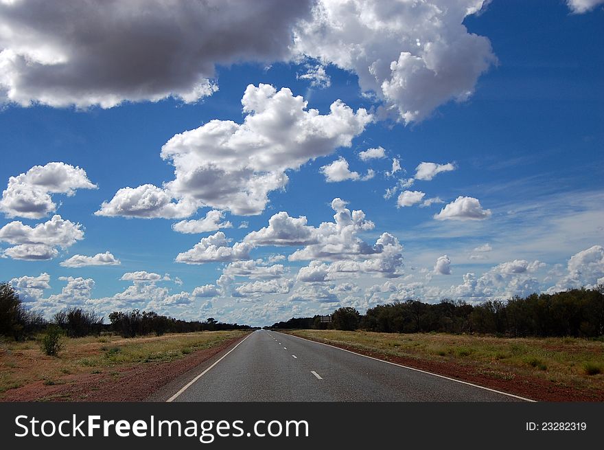 Highway with cloudy sky in Australian outback. Highway with cloudy sky in Australian outback