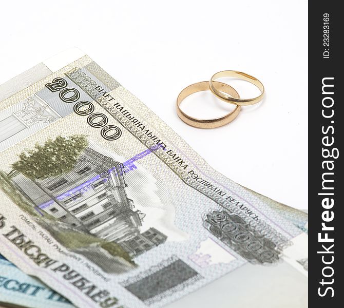 Paper money with wedding rings. Paper money with wedding rings