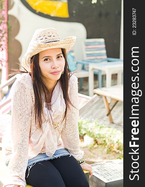 Attractive woman wearing hat for portrait outdoor