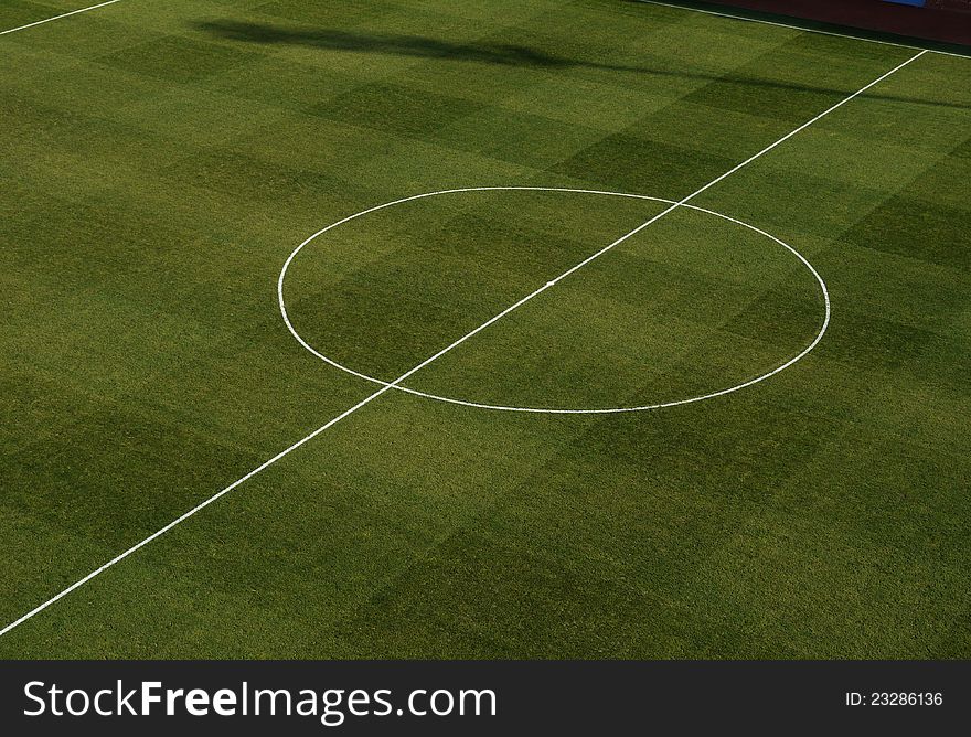 Center of a football field sports, green lawn, marking. Center of a football field sports, green lawn, marking