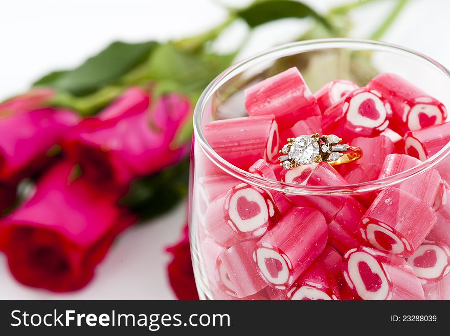 Diamond Ring and Candy in wine glass