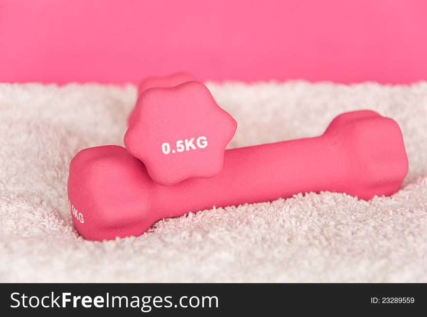 Pink Weights On White Towel