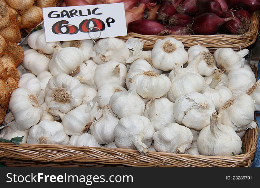 A Display of Garlic Bulbs on a Market Stall. A Display of Garlic Bulbs on a Market Stall.