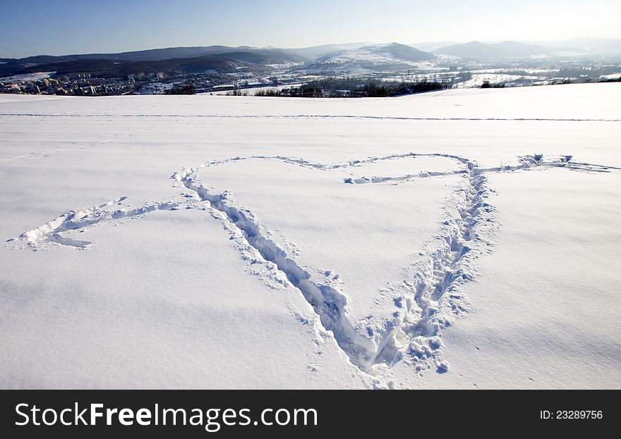 White snow with drown heart shape. White snow with drown heart shape