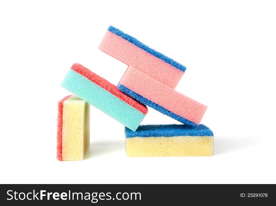 Colourful tower of kitchen scourers.  on a white background.  Clipping path.  In order to help wash dishes.