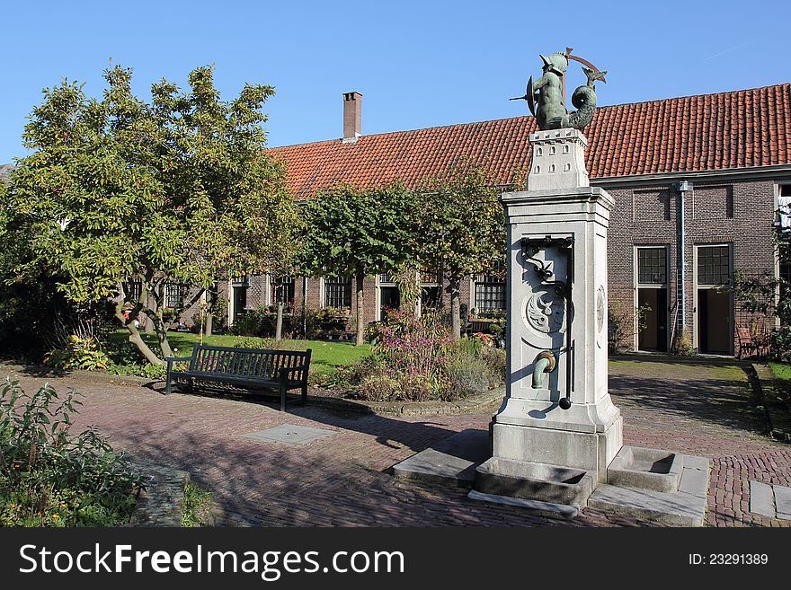 Almshouse Leiden With Water Pump