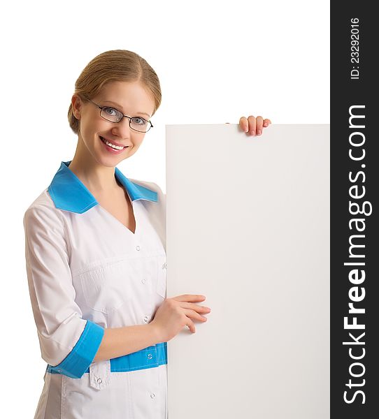 Beautiful young female doctor holding a blank billboard isolated on white background