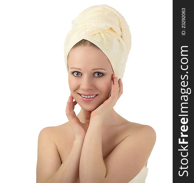 Portrait of a beautiful healthy girl in a clean towel isolated on white background