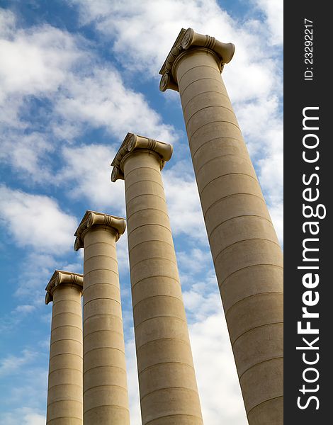 Four massive columns, blue sky