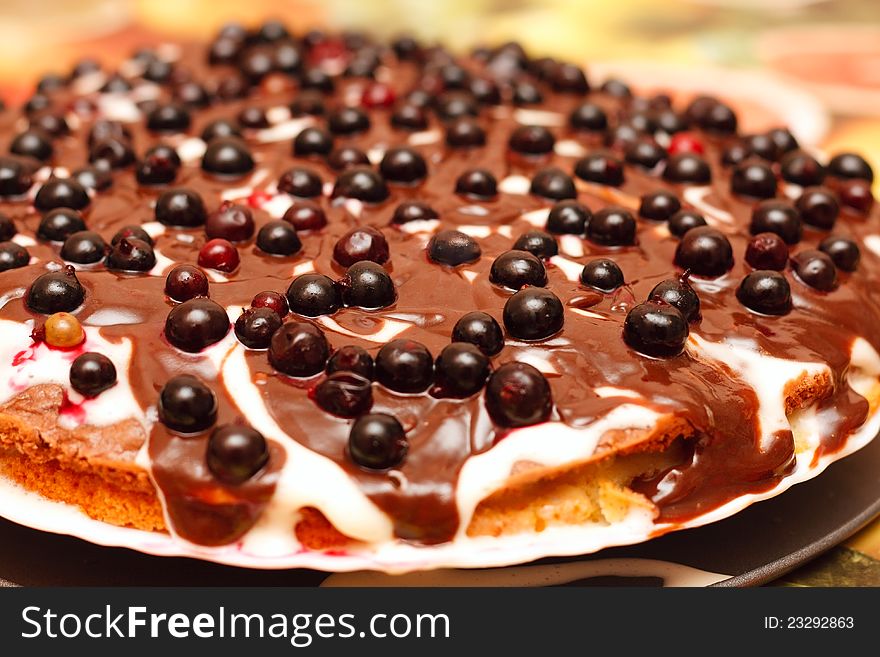 Closeup of Chocolate pie with berries (a black currant)