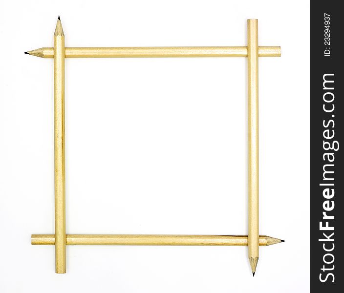 Four pencils arranged to form a square frame on white background.