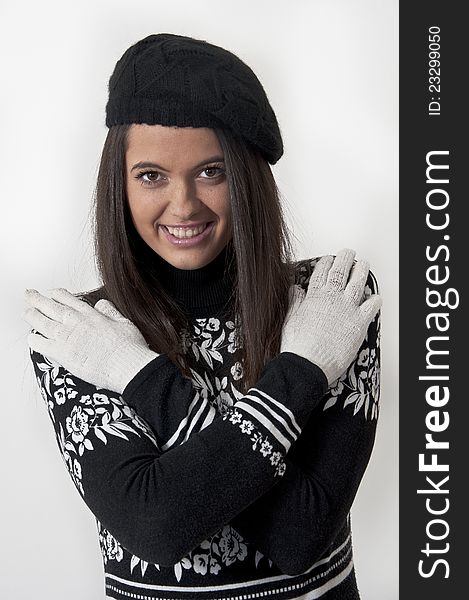 Beautiful young girl in winter clothes photographed in studio. Beautiful young girl in winter clothes photographed in studio