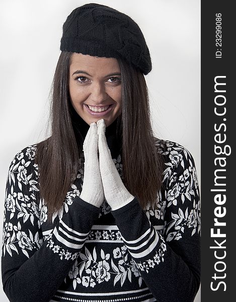 Beautiful young girl in winter clothes photographed in studio. Beautiful young girl in winter clothes photographed in studio