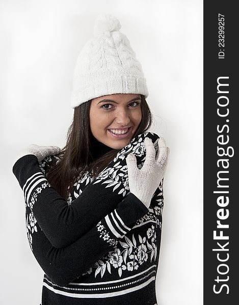 Beautiful young girl in winter clothes photographed in studio. Beautiful young girl in winter clothes photographed in studio