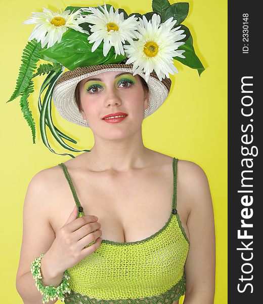 Beauty smiling girl with flowers in her hat. Beauty smiling girl with flowers in her hat